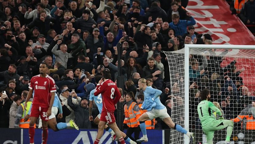 Man City snatch chaotic 2-1 win at Liverpool to stay on Arsenal's heels