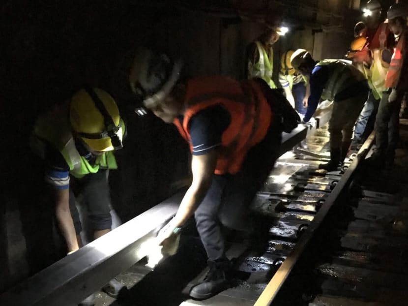 Engineers work to clear a flooded tunnel between Braddell and Bishan MRT stations. SCDF said that at approximately 11am on Sunday, the water in the tunnels had been completely cleared. Photo: LTA
