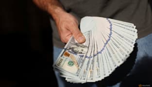 Dollar edges lower against yen in week packed with data releases and central bank decisions