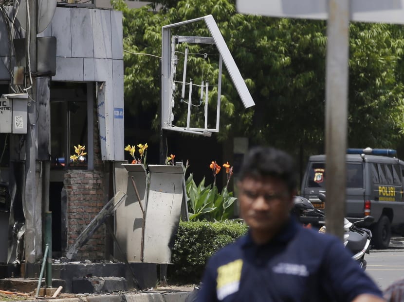 Seven dead in Jakarta blasts, gunfight