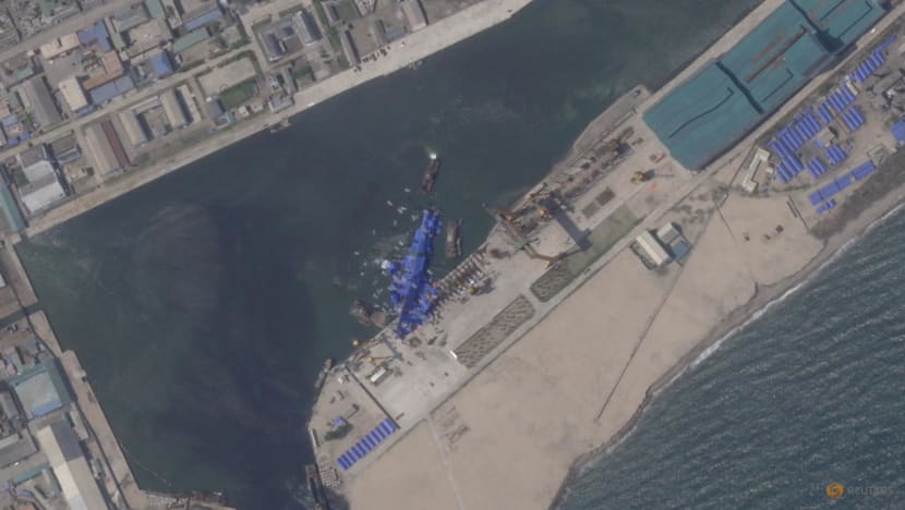 North Korea pulls capsized warship upright after botched launch, report says