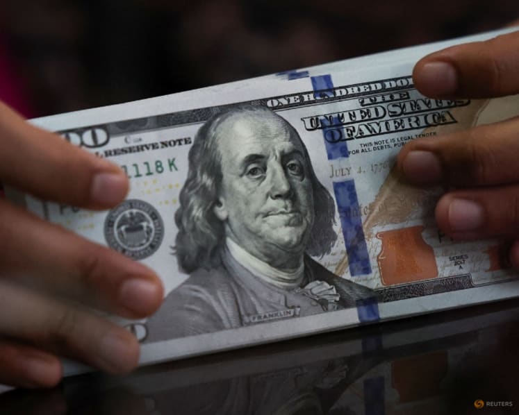 Dollar near two-week high as oil surge lifts yields, Fed hike bets