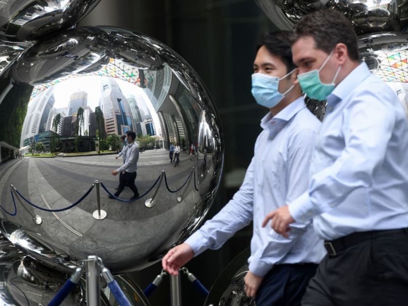 Men pictured walking past an art installation in the financial business district in Singapore. Prime Minister Lee Hsien Loong said that the Government must be able to show that staying open to foreigners is beneficial to Singaporeans. Men pictured walking past an art installation in the financial business district in Singapore. Prime Minister Lee Hsien Loong said that the Government must be able to show that staying open to foreigners is beneficial to Singaporeans.