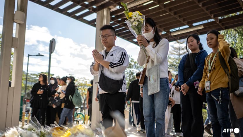Hong Kong mourns victims of blaze that killed 128 and counting