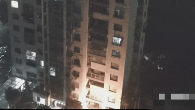 中国女子一小时内11次扔烟蒂下楼 引发住宅区火患