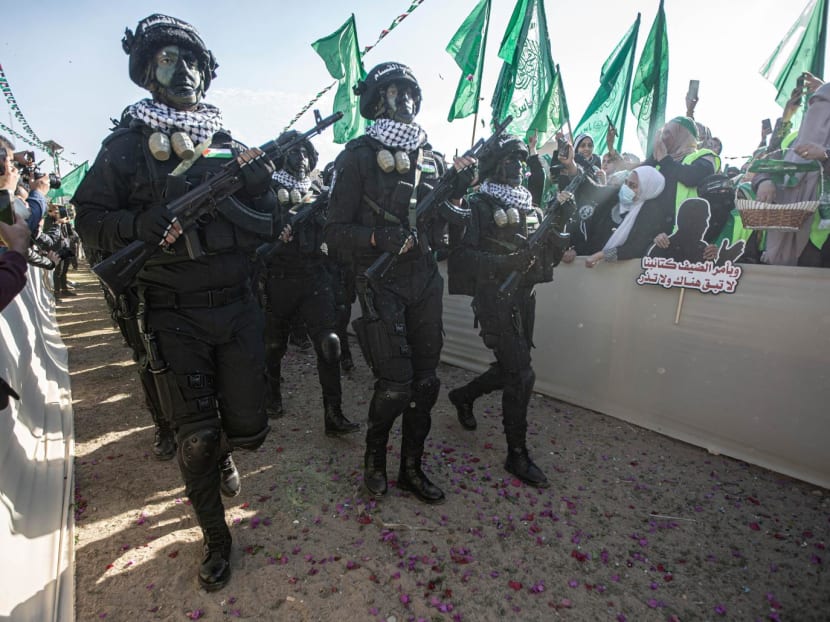 Armed elements of the Izz al-Din al-Qassam Brigades called the "Chorus Unit", the military wing of the Palestinian Hamas movement, participate in the thirty-fifth anniversary of the founding of Hamas in Gaza City. Armed elements of the Izz al-Din al-Qassam Brigades called the "Chorus Unit", the military wing of the Palestinian Hamas movement, participate in the thirty-fifth anniversary of the founding of Hamas in Gaza City.