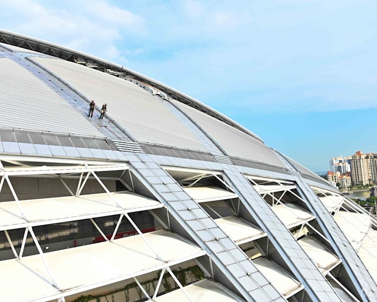What does it take to clean the world’s largest dome? Men suspended by ropes