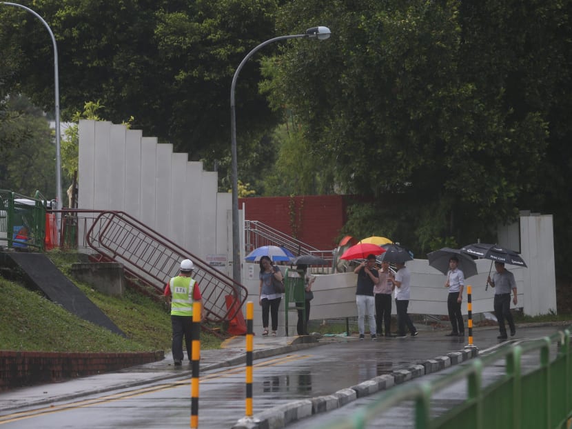 Personnel from the Bishan East-Thomson CCC were spotted near the site of the flash flood at Upp Thomson
. Photo: Ooi Boon Keong/ TODAY