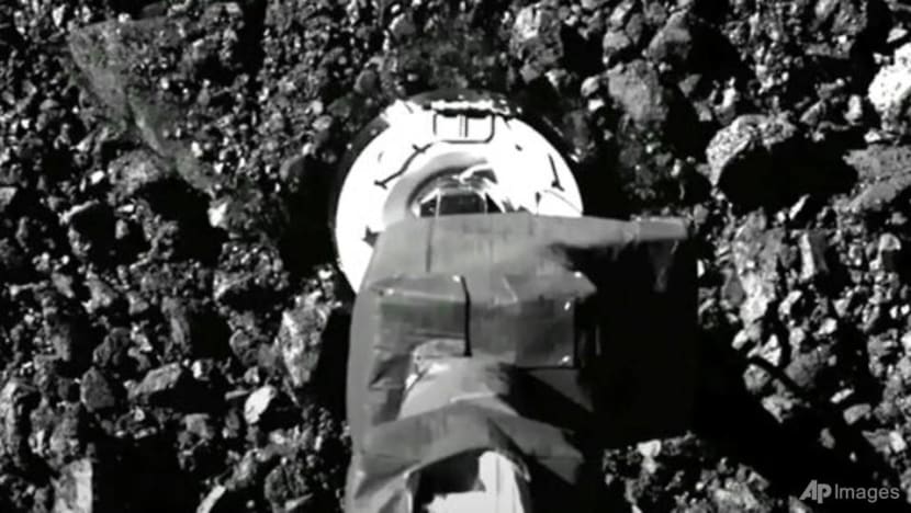Asteroid samples escaping from jammed NASA spacecraft