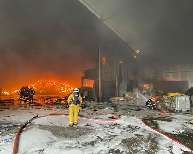 Firefighter injured after blaze involving piles of waste material at Woodlands Industrial Park