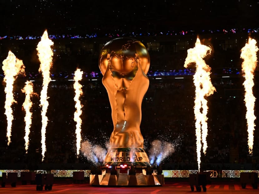 Fireworks explode around a replica of the Fifa World Cup trophy during the opening ceremony ahead of the Qatar 2022 World Cup Group A football match between Qatar and Ecuador at the Al-Bayt Stadium in Al Khor, north of Doha on Nov 20, 2022.
Fireworks explode around a replica of the Fifa World Cup trophy during the opening ceremony ahead of the Qatar 2022 World Cup Group A football match between Qatar and Ecuador at the Al-Bayt Stadium in Al Khor, north of Doha on Nov 20, 2022.