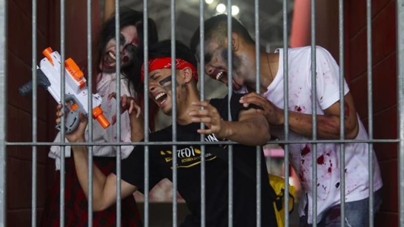 Battle zombies using Nerf guns in a survival game at the National Stadium