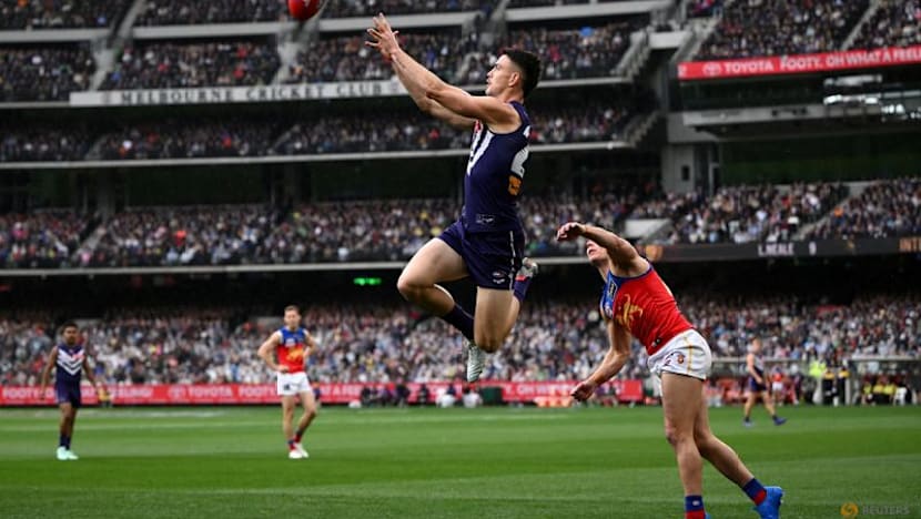Australian Rules-Brisbane hold off Fremantle in thriller to win third straight AFL Grand Final