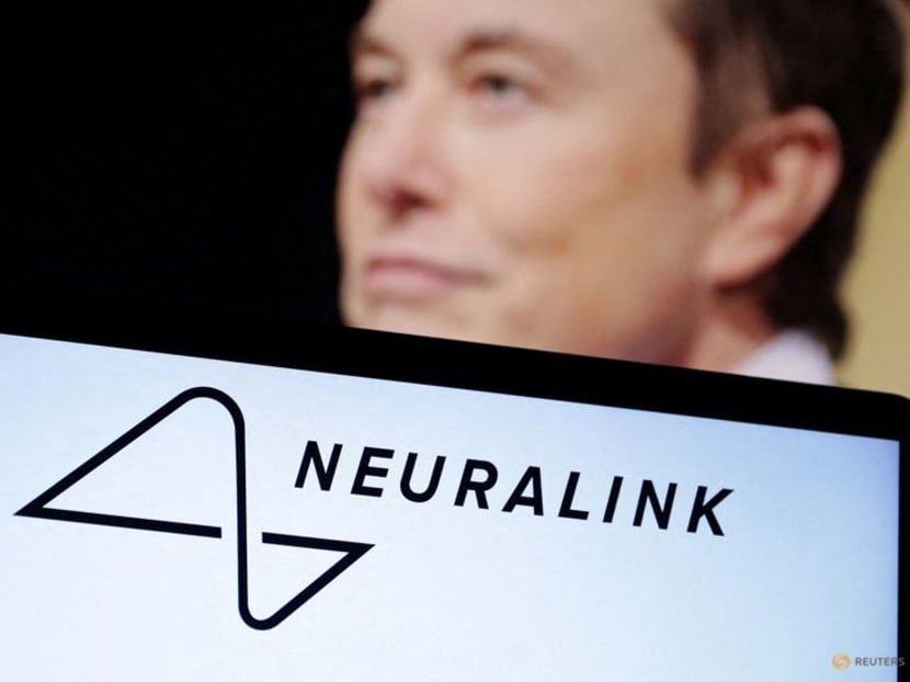 Neuralink logo and Elon Musk photo are seen in this illustration taken on Dec 19, 2022. 