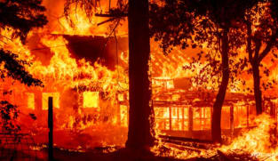 California's largest fire burns homes as blazes scorch West