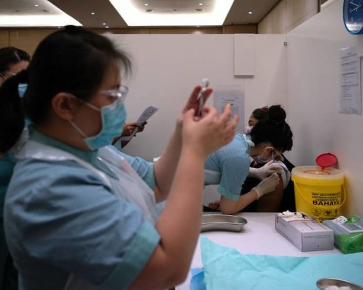 Malaysia's new COVID-19 cases cross 20,000 mark for first time, setting record for 2nd day