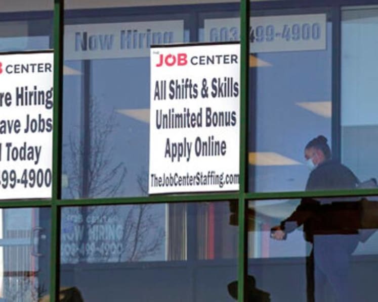 US jobless claims fall to 406,000, a new pandemic low