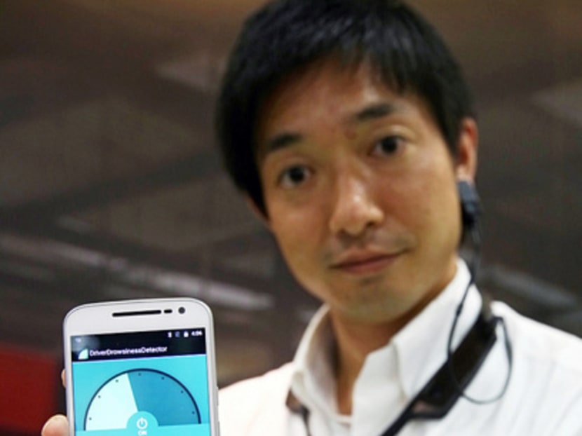 Fujitsu’s Driver Drowsiness Detector is worn around the neck and can detect when a driver’s pulse is slowing down because he is dozing off. Photo: Nuria Ling