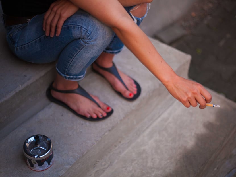 Half of the cigarettes sold in Singapore are flavoured with menthol. Tobacco companies add menthol into cigarettes to hook young people, the author says.