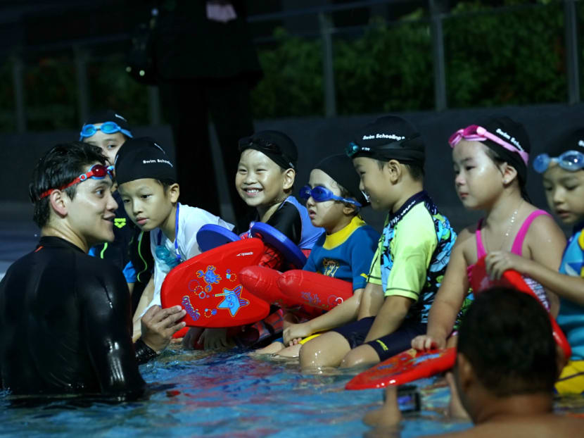 Joseph Schooling interacting with the children, including Emma Ong (blue goggles) during the launch of Swim Schooling at Our Tampines Hub. Joseph Schooling interacting with the children, including Emma Ong (blue goggles) during the launch of Swim Schooling at Our Tampines Hub.
