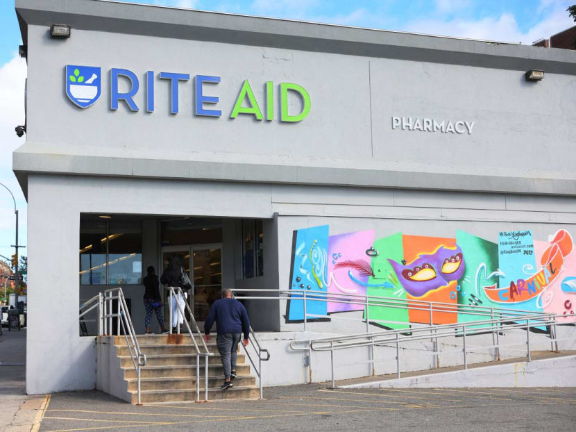 People enter a Rite-Aid on Oct 16, 2023 in the Crown Heights neighborhood of the Brooklyn borough of New York City.