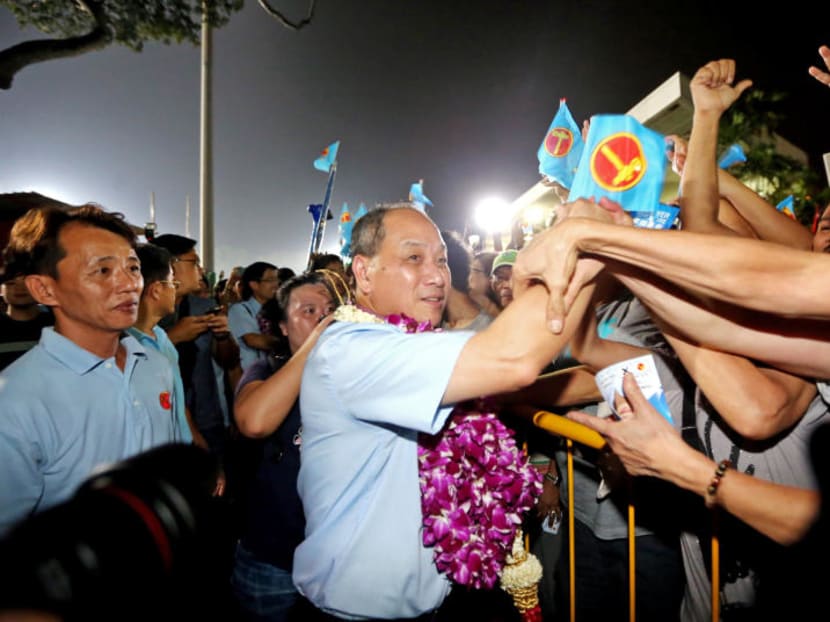 Mr Low Thia Khiang shaking hands with residents at the end of the Workers' Party rally at Bedok Stadium on Sept 9, 2015. Mr Low Thia Khiang shaking hands with residents at the end of the Workers' Party rally at Bedok Stadium on Sept 9, 2015.