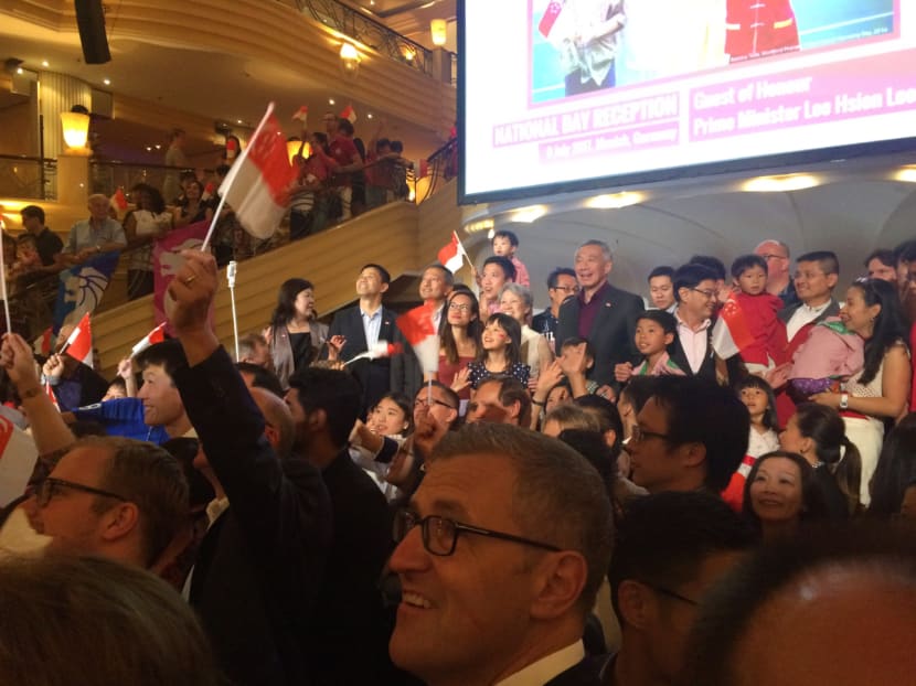 PM Lee Hsien Loong taking a group photo with Singaporeans at Munich's Bayerischer Hof hotel in an early celebration of National Day. Photo: Neo Chai Chin